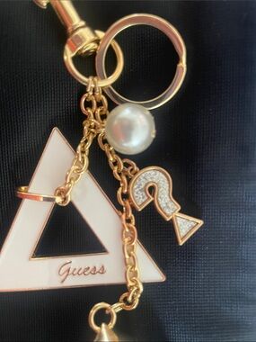 GUESS White and Gold Logo Tassel Handbag Charm